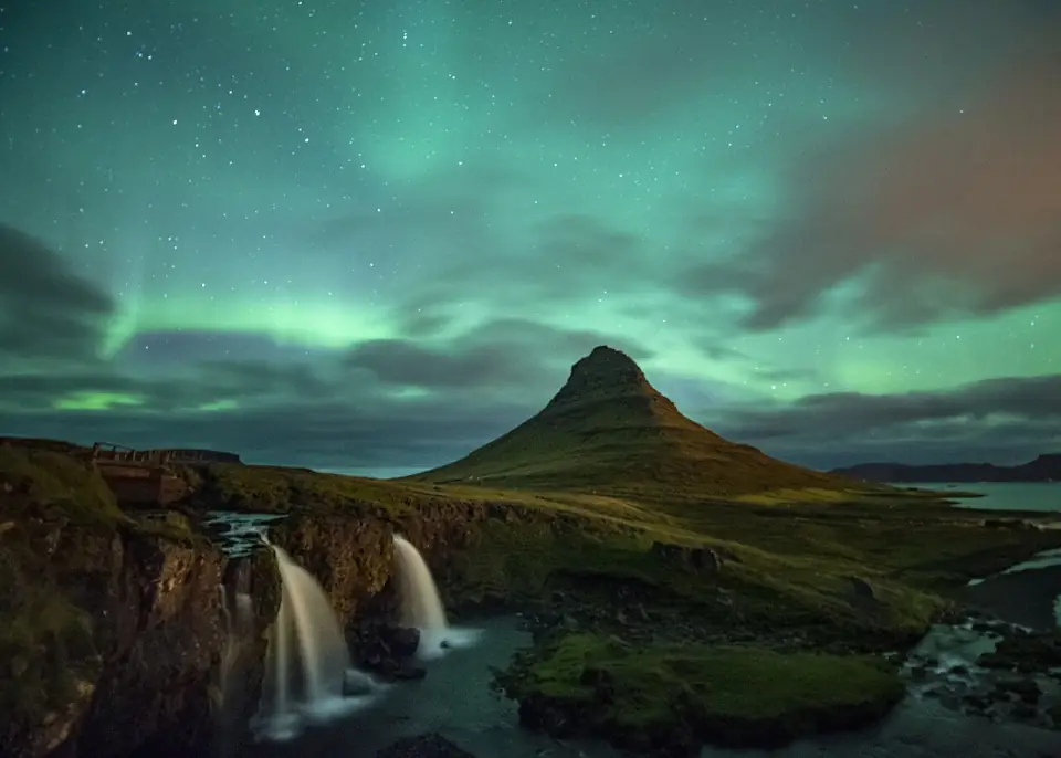Aurora Borealis activity on top of the Kirkjufell mountain in September 2018